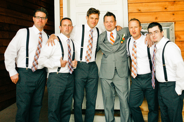 groomsmen with grey suits orange ties