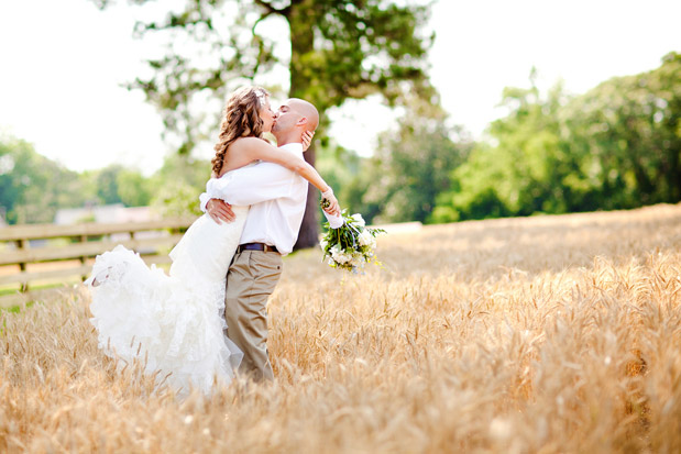 bride and groom in wheat field